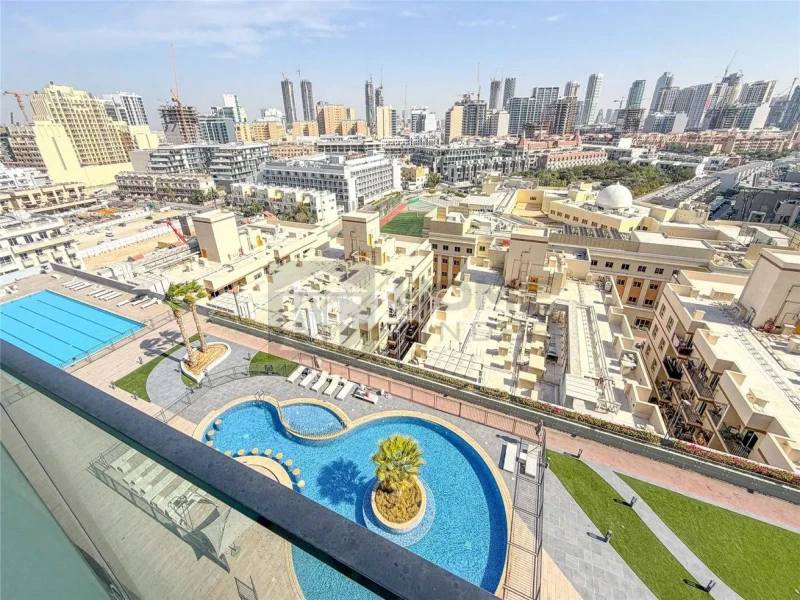 Apartment for Rent in Bloom Tower B - Jumeirah Village Circle, Dubai - Fully Furnished | 12 cheques | Balcony | Pool View at 85000 AED